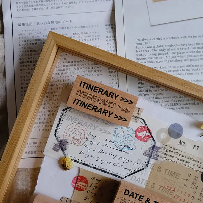 Wooden frame with 'ITINERARY' sign on a textured surface with text and stamps.