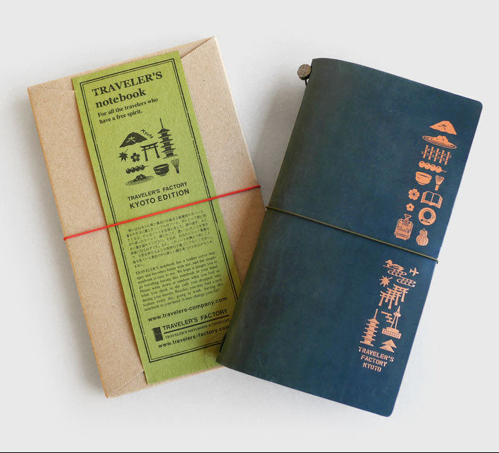 Blue notebook with green label on a white background