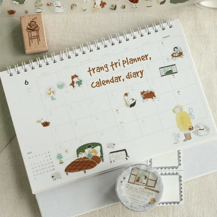 Calendar page decorated with cute Uchi No Wanchan PET Tape illustrations on a textured surface