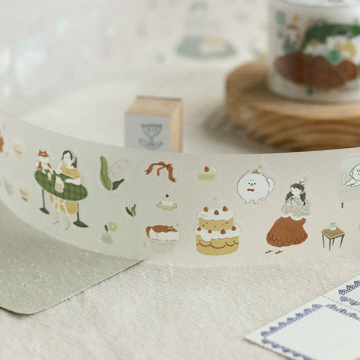 Strip of Uchi No Wanchan PET Tape home-inspired dog scenes applied on a textured surface