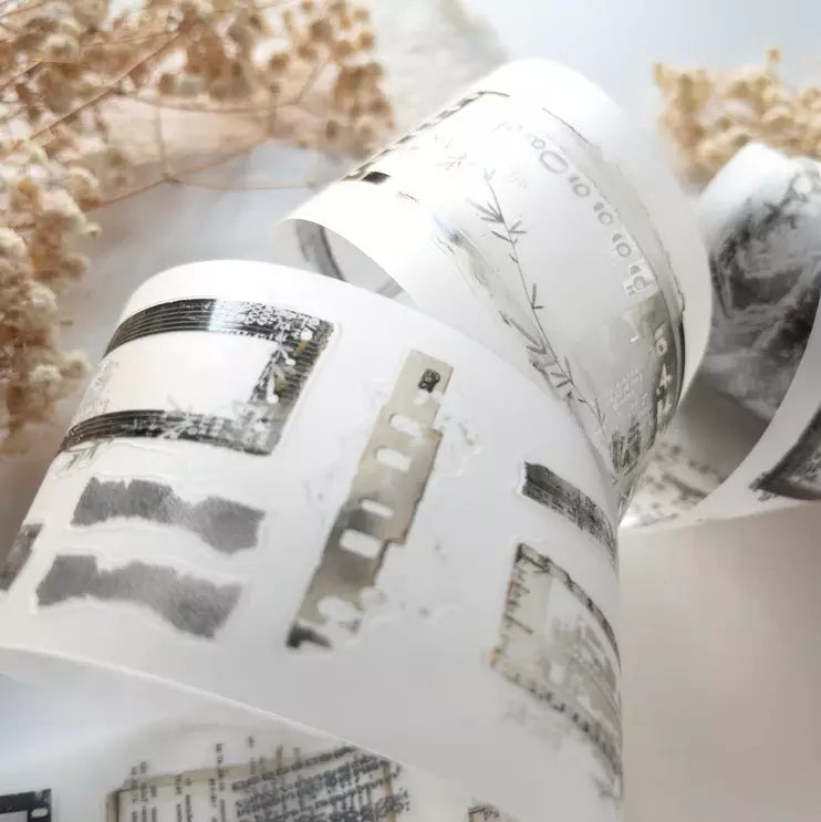 Roll of Untold PET Tape showing its architectural design motifs on a light background