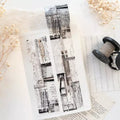Two black and white patterned bookmarks on a textured surface with dried flowers.