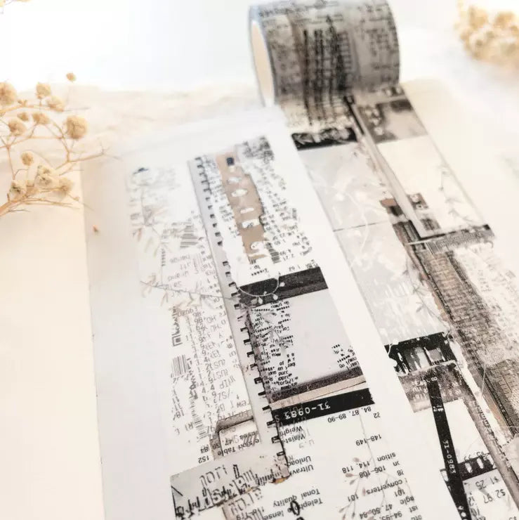 Single roll of Untold Washi Tape showing its architectural design on a light surface