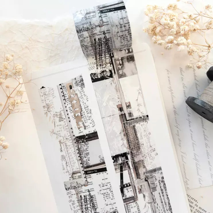 Three Untold Washi Tape monochrome strips styled with dried flowers on a textured surface