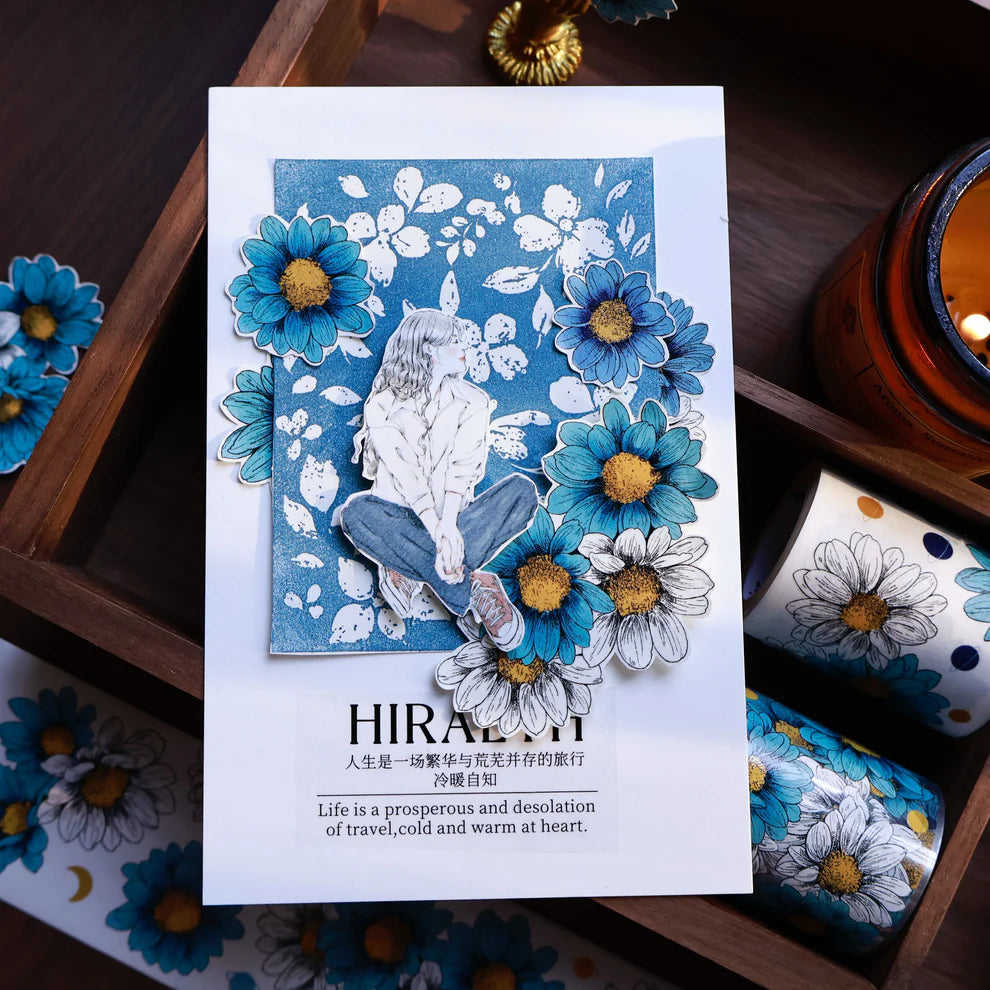 Card with floral design and text on a wooden surface
