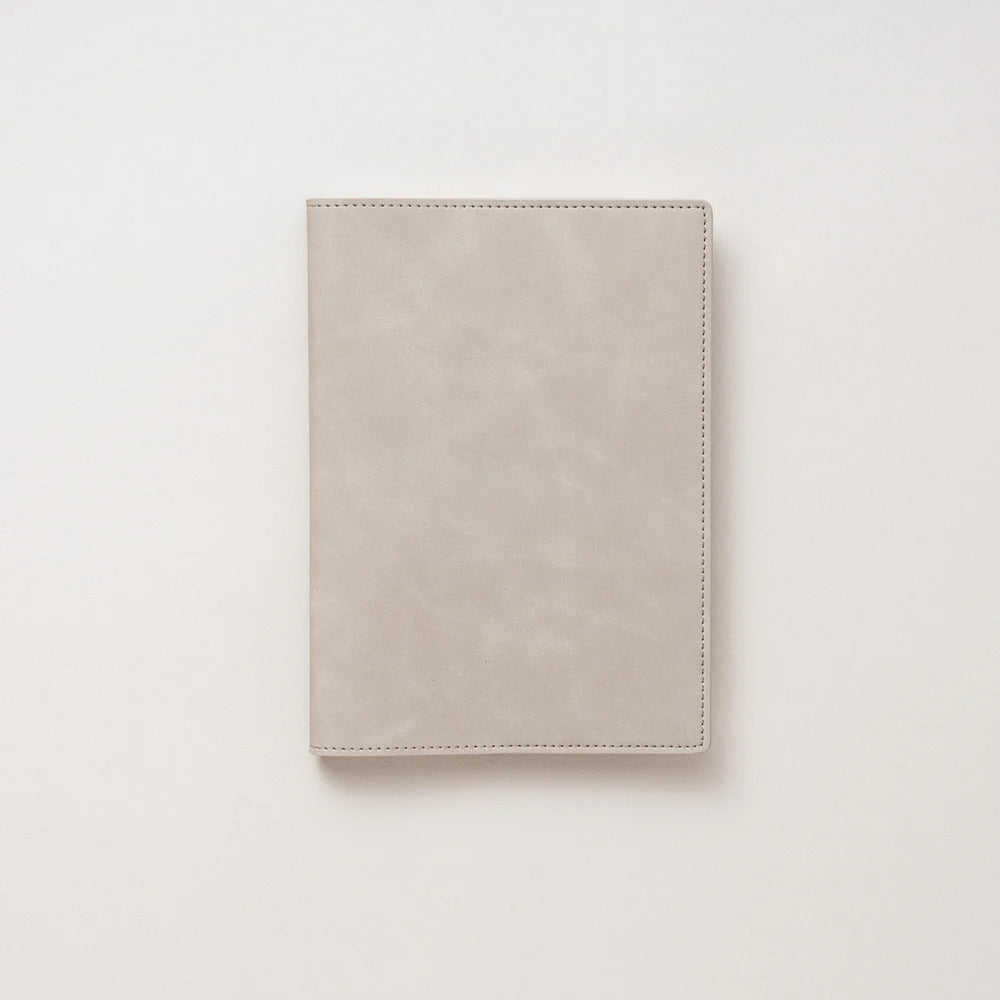 Beige leather wallet on a light beige background