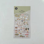 Sheet of illustrated stickers with various designs on a light gray background