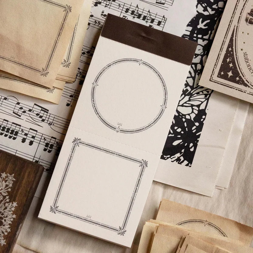 Vintage Frame Label Memo Pad sheets with decorative borders on a music sheet background