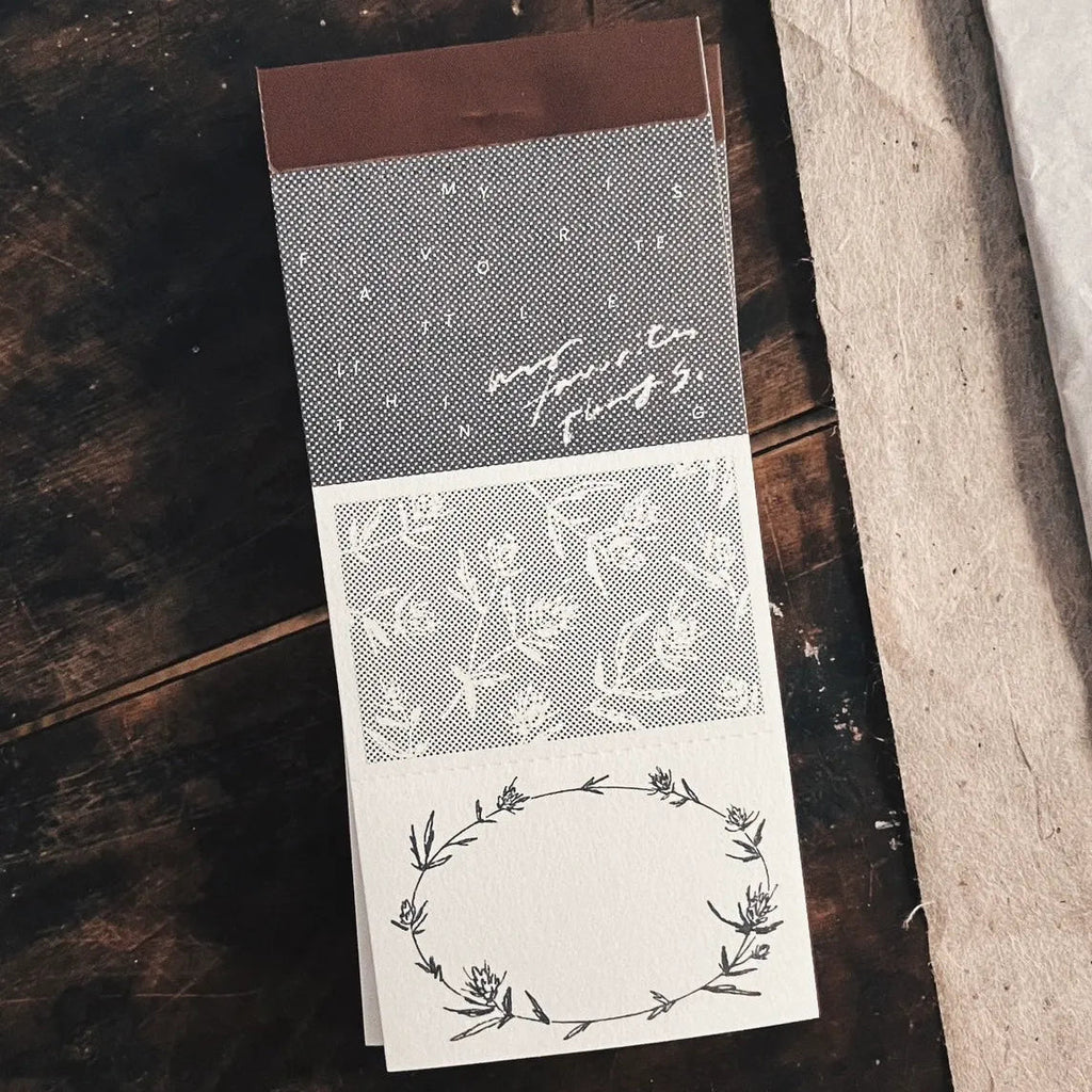 Decorative paper with floral patterns on a wooden surface