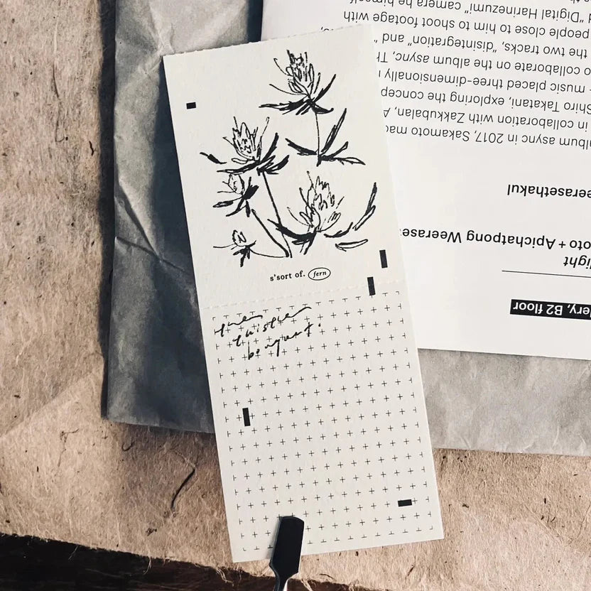 Vintage Hand-Torn Bouquet Memo Pad with brushstroke florals and text on a textured surface
