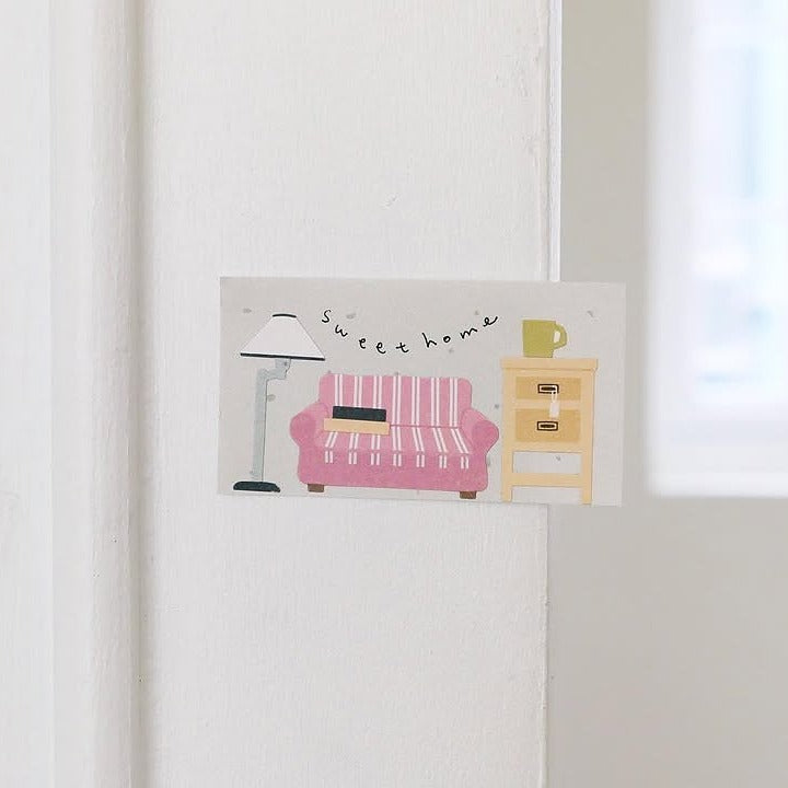 Wall art with a pink sofa, lamp and coffee table illustration, from the Vintage House Sticker Sheet