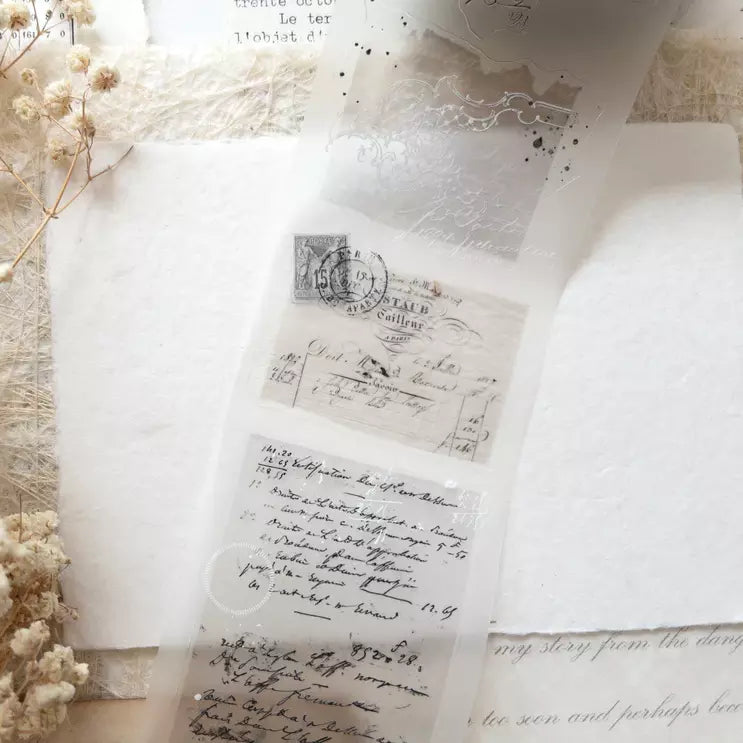 Vintage Layers PET Tape letter-and-stamp design with dried flowers on a textured surface
