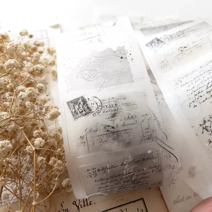 Translucent Vintage Layers PET Tape text stickers on white with dried flowers alongside