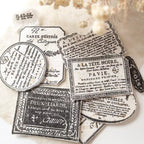 Vintage-style black and white labels on a textured beige background