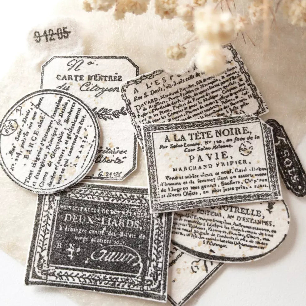 Vintage French Labels Clear Stamp black and white label prints on a textured beige backdrop