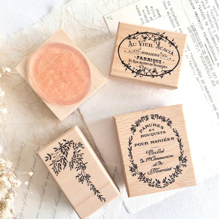 Vintage Rubber Stamp Set wooden stamps with botanical and typography designs on textured paper