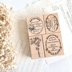 Aesthetic flat lay of vintage wooden stamp set with dried flowers and handwritten paper background