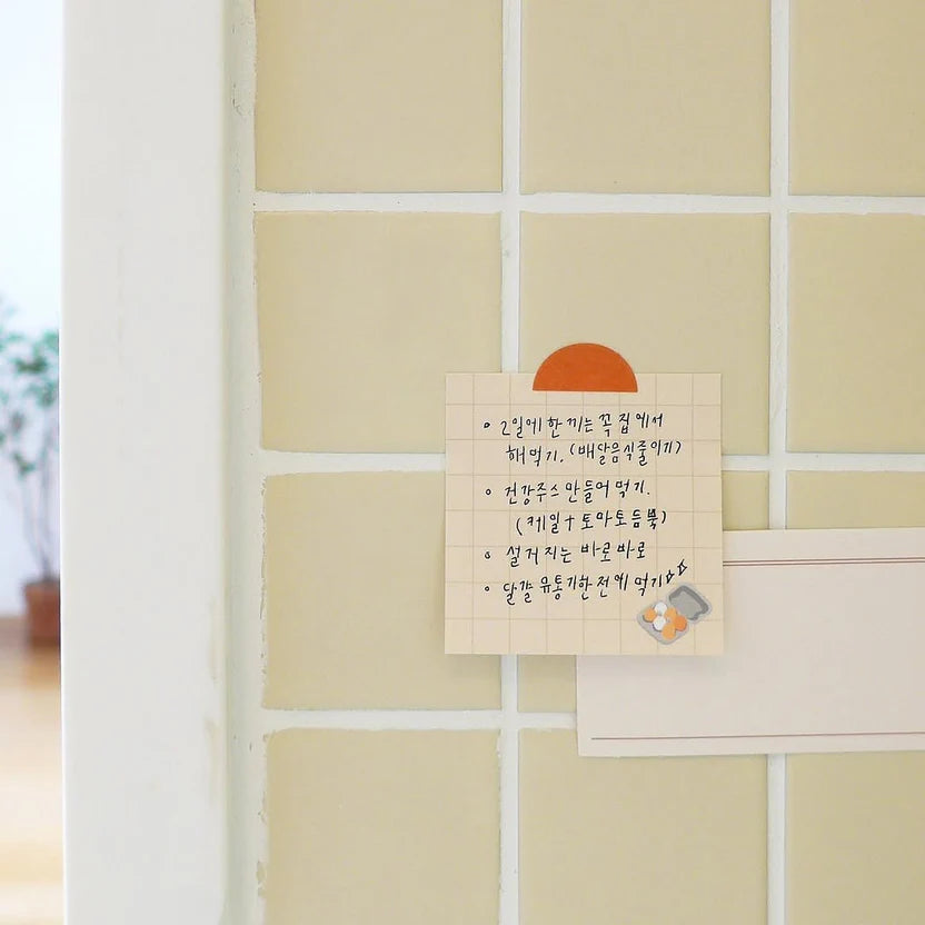 Note on a tiled wall with a small sun and cat illustration, from the Vlog Cooking Sticker Sheet