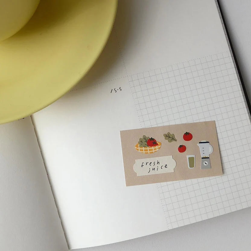 Sticker with fruit and juice elements on a notebook page