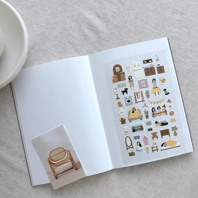 Open book with furniture and home decor stickers, from the Vlog Home Sticker Sheet