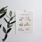 Sheet of paper with illustrated daily routine steps on a white surface with a plant.
