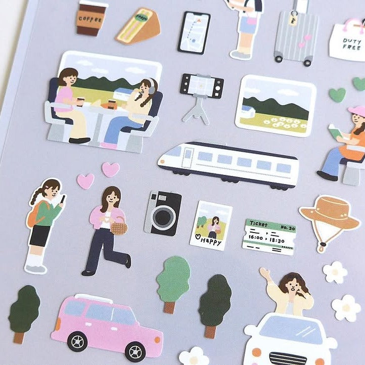 Collection of travel-themed stickers on a gray background