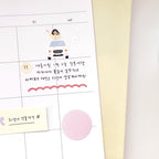 Calendar with a cartoon illustration of a person driving a car, surrounded by Korean text and decorative elements.