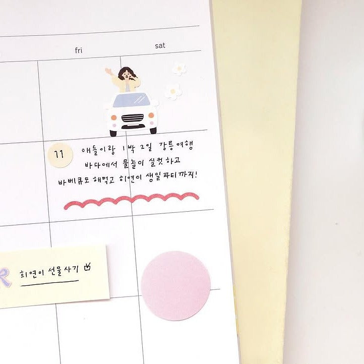 Calendar with an illustration of a person driving a car and Korean text, from the Vlog Trip Sticker Sheet