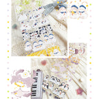 Collection of cute animal-themed stickers on a textured surface with decorative elements.