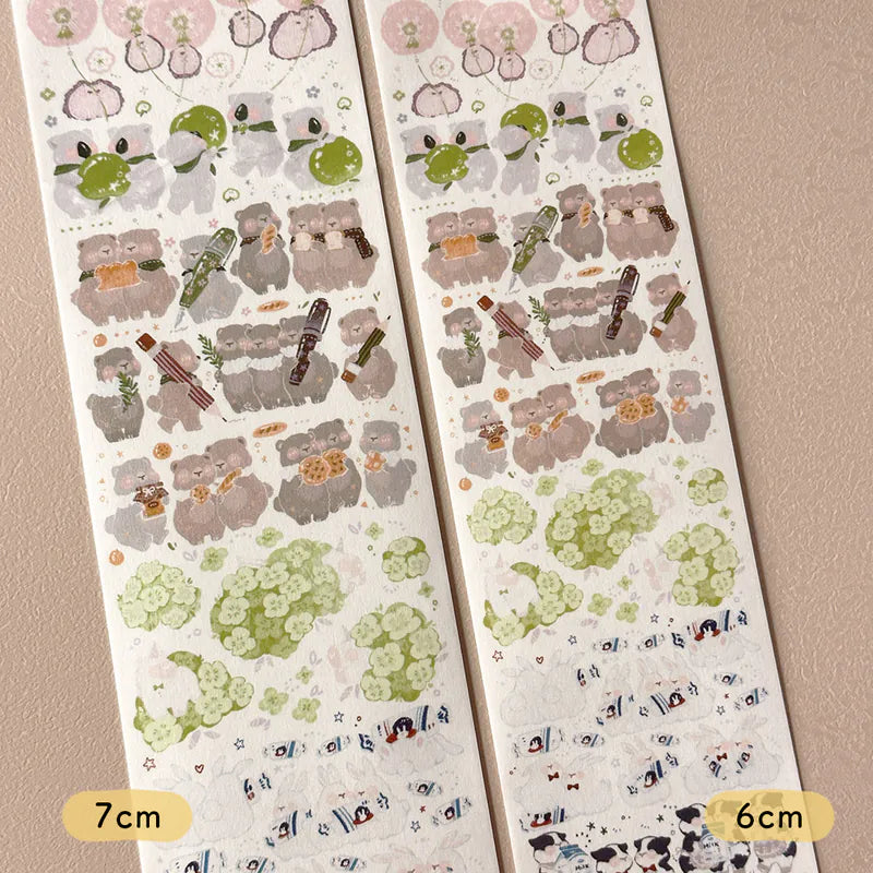 Two sheets of decorative stickers with cartoon animal designs on a beige background.