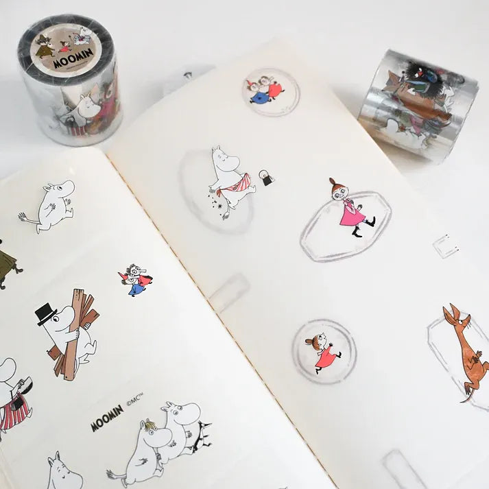 Sticker sheets with Moomin characters on a white surface