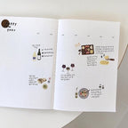Open book with illustrations and text on a white background
