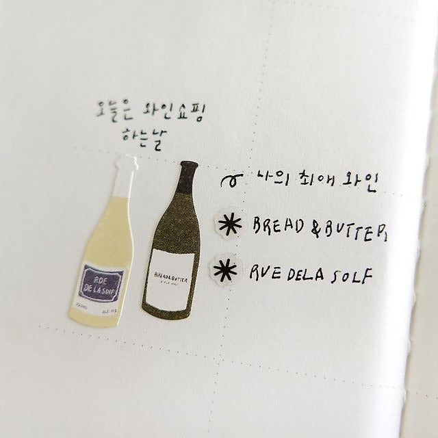 White apron with wine bottle illustrations and text, from the Wine Bar Sticker Sheet