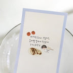 Card with illustrations of bread and text on a white background