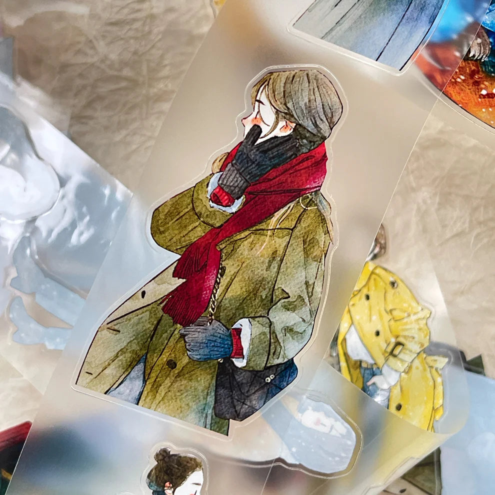 Winter Day PET Tape figure in a green coat and red scarf with a blurred background