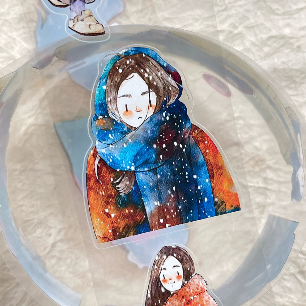 Winter Day PET Tape figure in a colorful scarf among snowflakes on a white backdrop