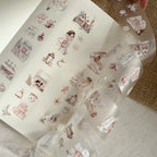 Sheet of decorative stickers with illustrations on a textured surface