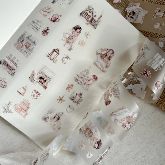 Sheets of Winter Wonderland PET Tape winter illustrations laid side by side on a textured surface