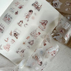 Sheets of decorative stickers with illustrations on a textured surface