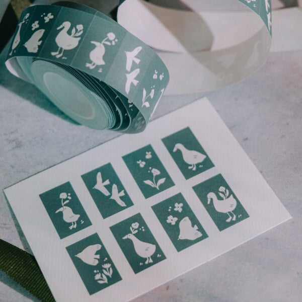 Woodland Story Label Sticker Tape green duck-design roll displayed on a grey surface