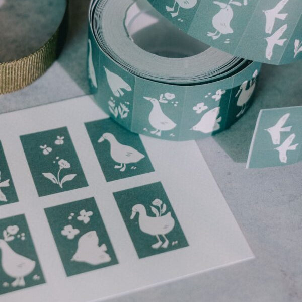 Strip of Woodland Story Label Sticker Tape green duck labels on a light grey surface