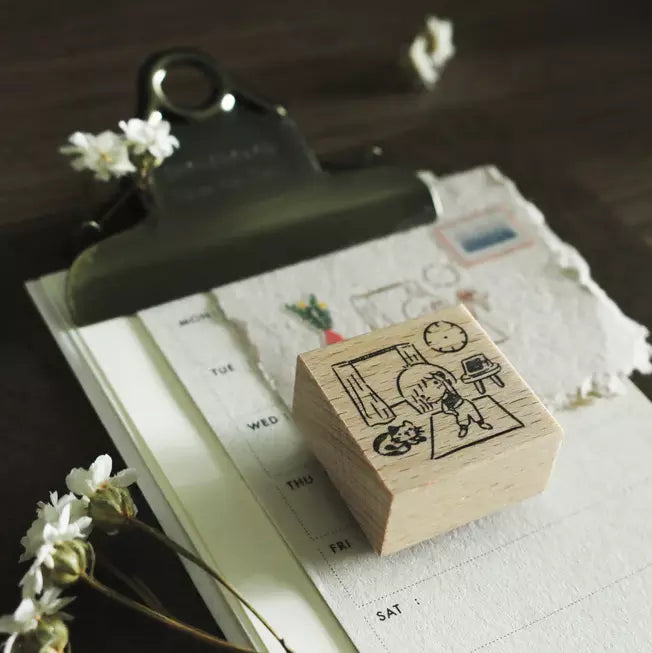 Mini Girls Workout stamp on a calendar page with a clip and dried flowers styled around
