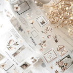 Collage of decorative paper sheets with floral and vintage designs on a textured surface.