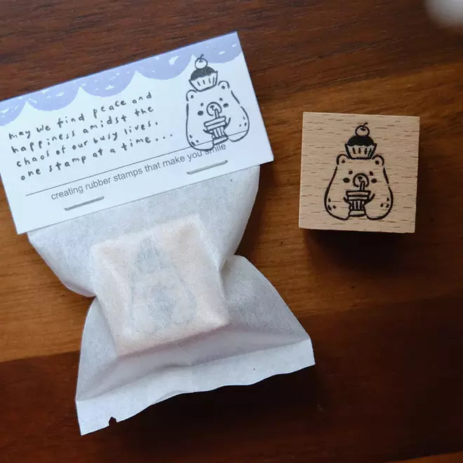Foodie Bears Cupcake bear stamp with its kraft packaging displayed on a wooden surface