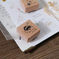 Wooden stamp with cartoon design on a notebook page