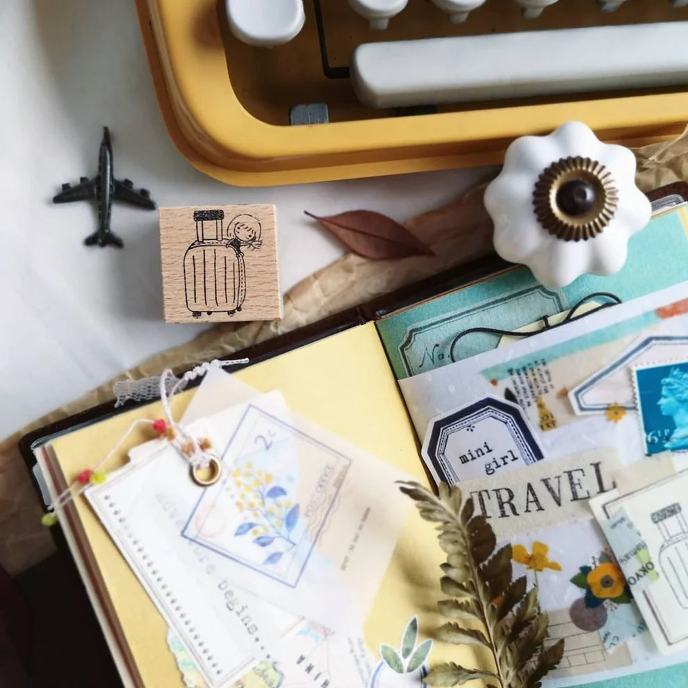 Mini Girls Travel Adventure Begins stamp styled with a stationery set and deco elements