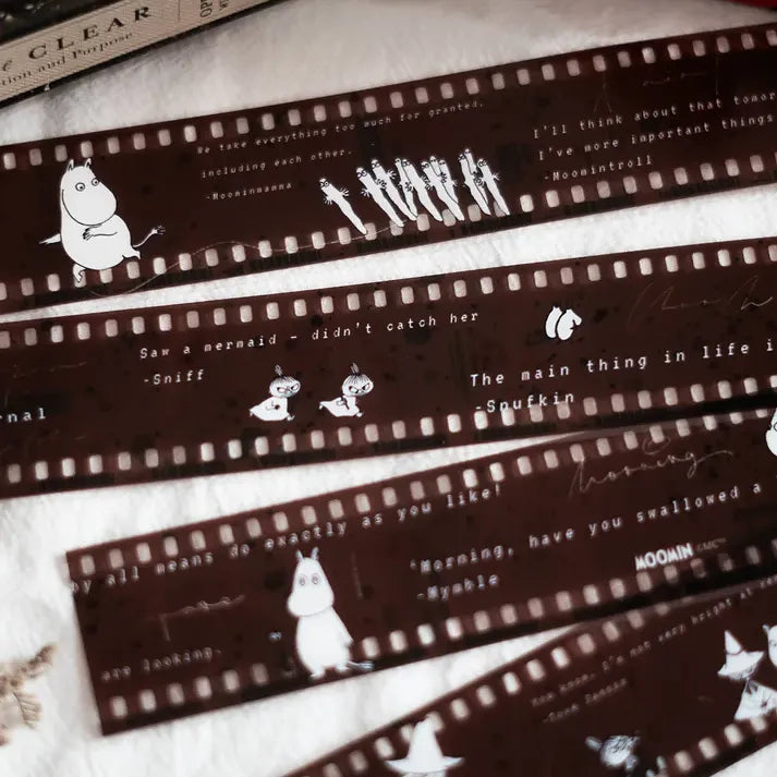 Filmoomin ft. Moomin PET Tape film strip featuring Moomin characters and quotes on white, top view
