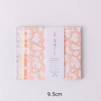 Pack of origami paper with decorative design on a light gray background