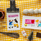 Stickers with cartoon characters and text on a yellow checkered background