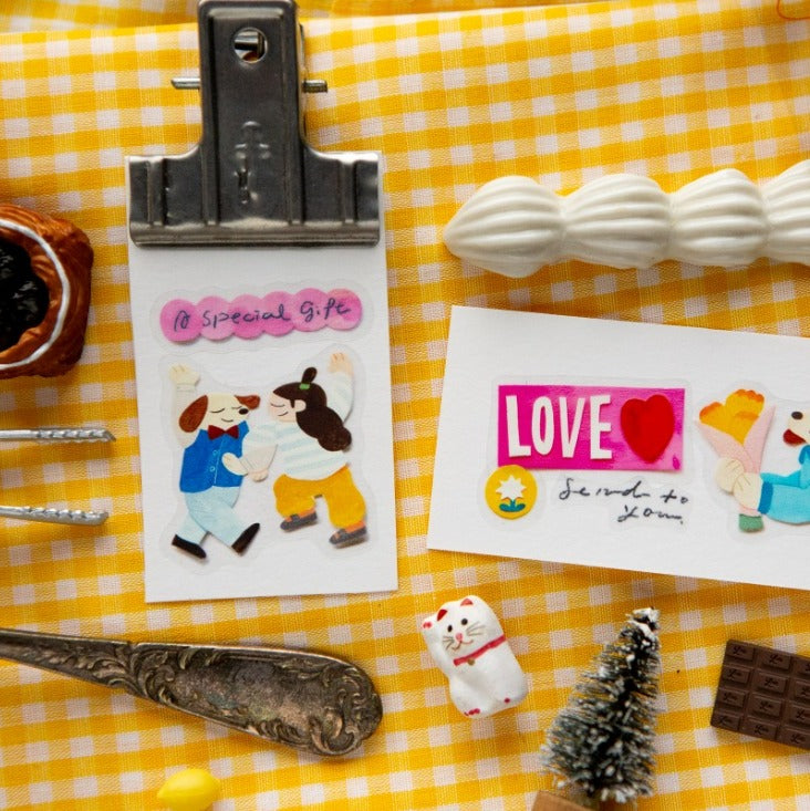 Stickers with cartoon characters and text on a yellow checkered background